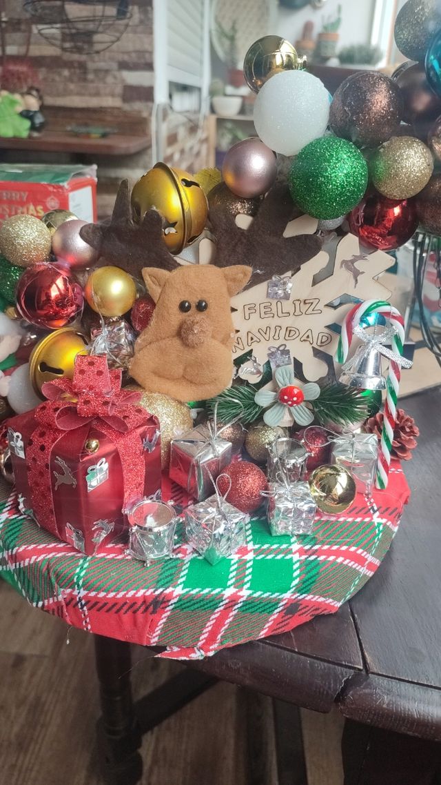 Centro de mesa navideño con vela