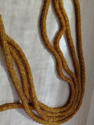 Maniglie per tende con perline dorate piume.