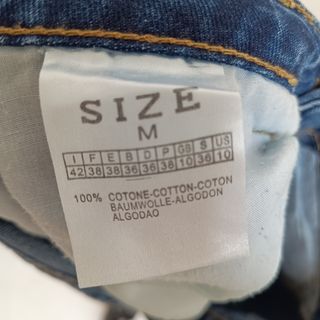 Calças ganga M com franjas douradas