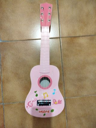 Guitarra rosa de juguete