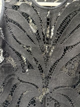 Camiseta calada con flecos