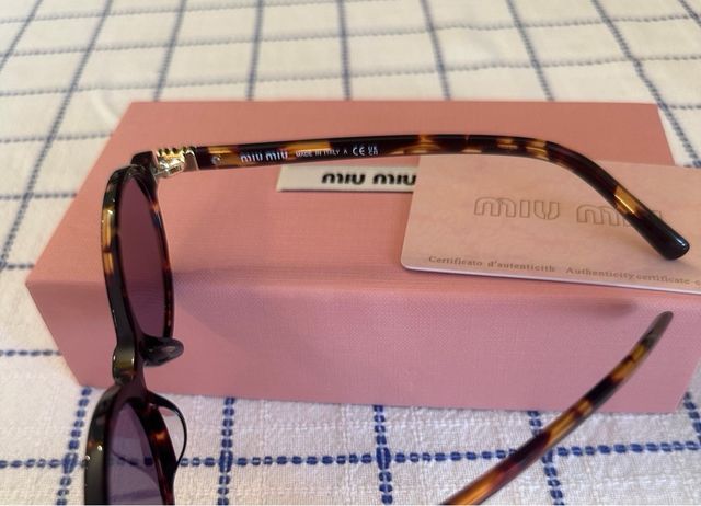 Occhiali da sole Miu Miu SMU04Z marroni