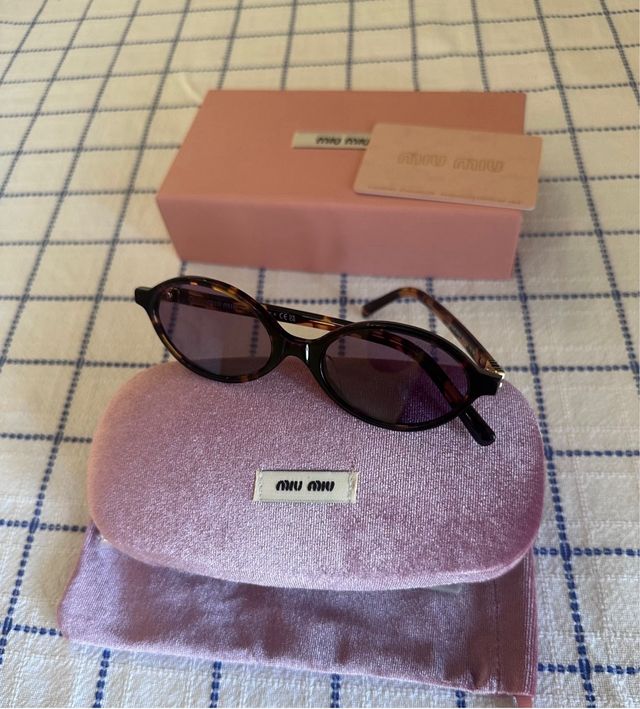 Occhiali da sole Miu Miu SMU04Z marroni