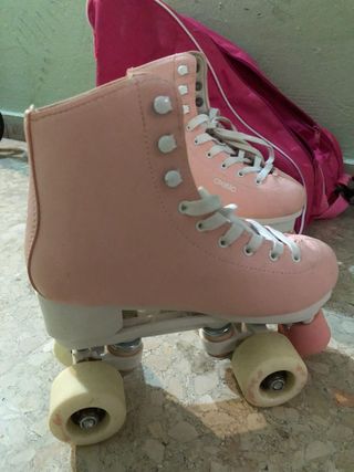 Patines de 4 ruedas rosas con la funda incluida