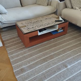 Mesa de centro elevable madera y cristal.