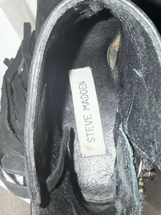 Stivali neri con frange in pelle