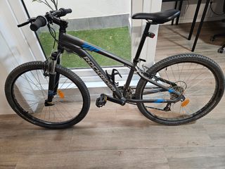 Bicicleta Montaña Rockrider ST100. 26".Para niño/a