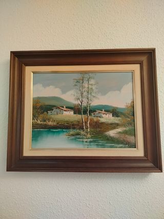 Cuadro paisaje con casas y río
