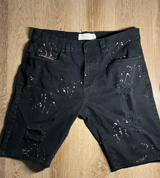 Pantalones cortos vaqueros negros con salpicaduras