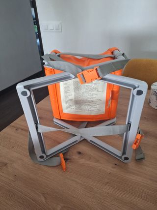 Trona de viaje naranja