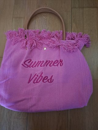 Bolso de playa rosa con flecos