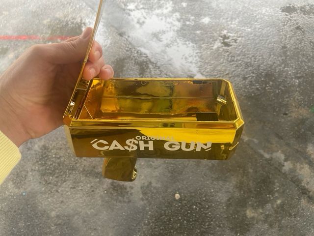 Pistola de Dinero Dorada nueva 