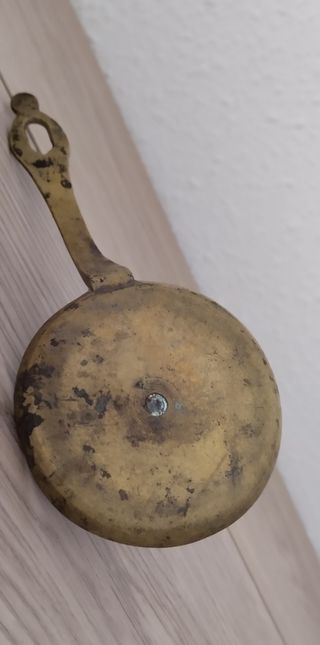 Antigua palmatoria de latón