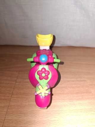 Moto de juguete rosa y verde