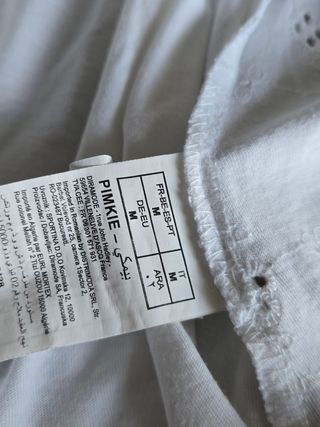 Blusa blanca bordada cuello bardot