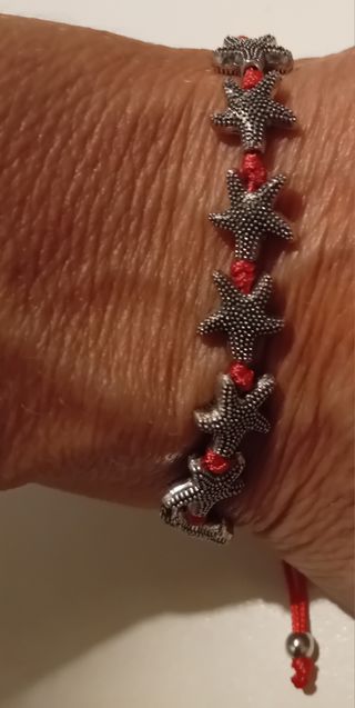 Braccialetto con filo rosa e stelle marine