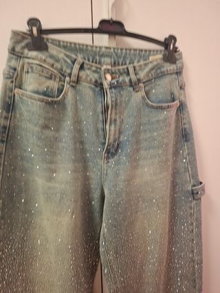 Jeans a gamba larga tempestati di strass