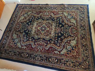 Alfombra de diseño floral azul y rojo