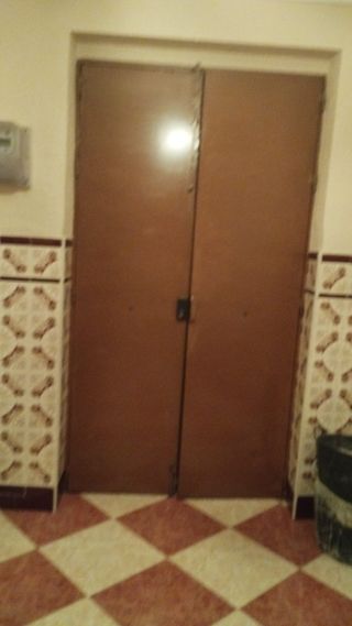 Portón y puerta de entrada forjados