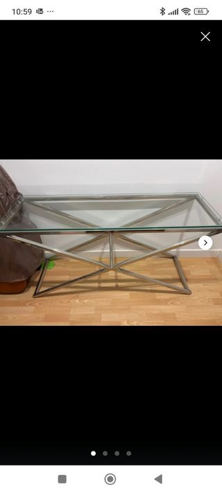 Mesa de cristal y metal plateado