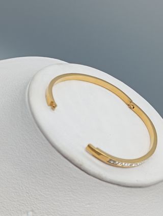 Pulsera rígida acero,baño de oro y circonitas