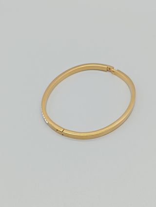Pulsera rígida acero,baño de oro y circonitas
