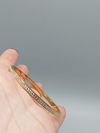 Pulsera rígida acero,baño de oro y circonitas