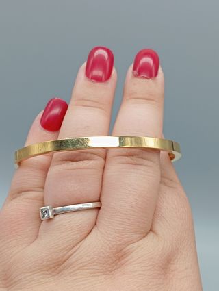 Pulsera rígida acero,baño de oro y circonitas