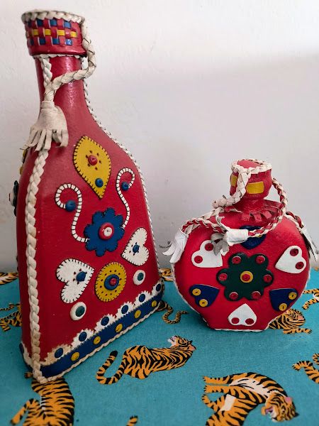 Coppia bottiglia e borraccia in pelle rossa