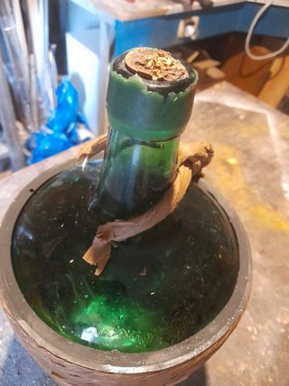 Coppia di vecchie damigiane verdi