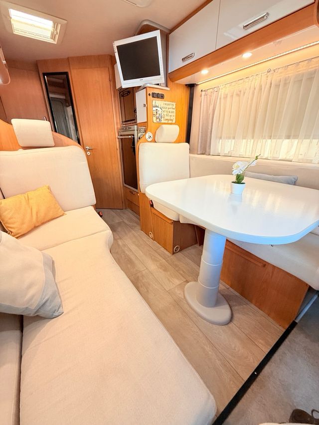 Autocaravana rutera 5.90m/aire//horno/alta gama