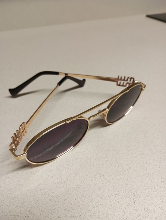 Gafas Miu Miu Doradas