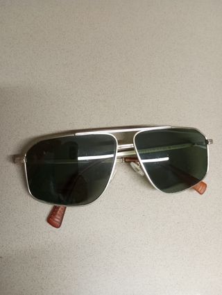 Gafas de sol Hawkers doradas y verdes