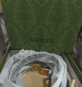 Cinturón Gucci Doble G Negro y Dorado