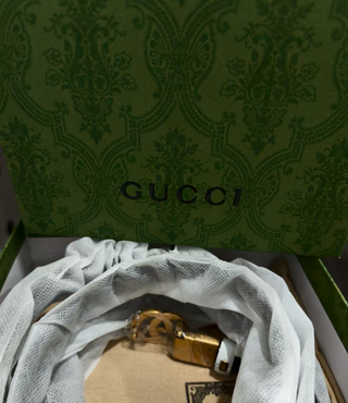 Cinturón Gucci Doble G Negro y Dorado