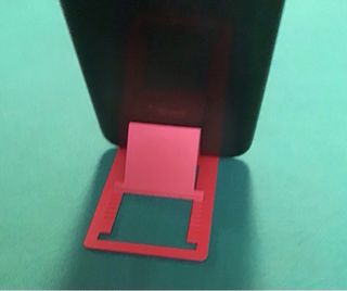 Supporto cellulare rosso tascabile