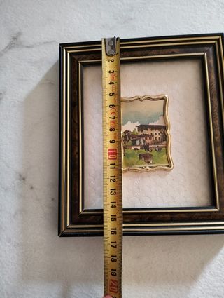 Quadro con cornice in legno e metallo