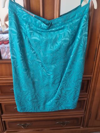 Traje de chaqueta y falda color turquesa