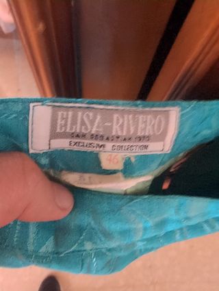 Traje de chaqueta y falda color turquesa