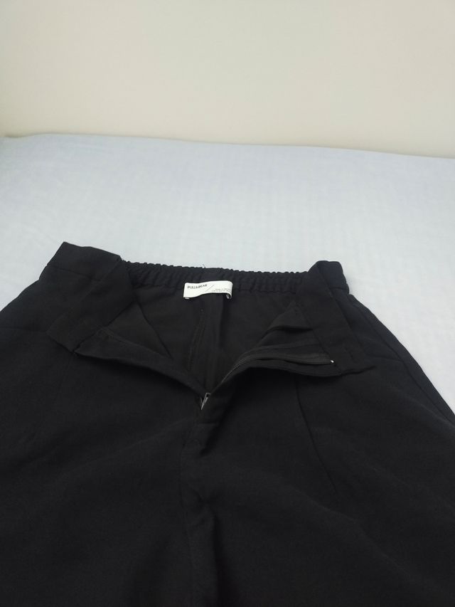 2 Pantalones chica Talla M negro y S verde