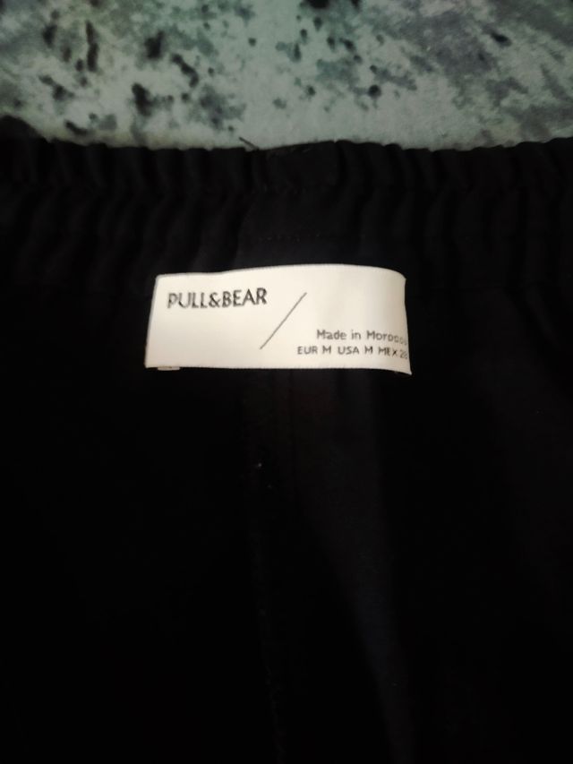 2 Pantalones chica Talla M negro y S verde