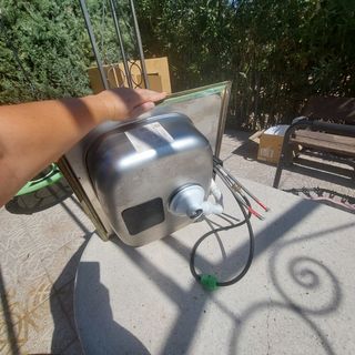 Fregadero Teka acero inox con grifo extraible.