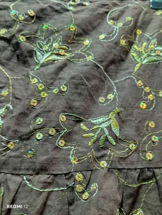 Falda forrada,con cremalleta volantes lentejuelas