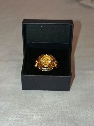 Anillo dorado de símbolo de dollar con brillantes 