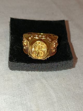 Anillo dorado de símbolo de dollar con brillantes 