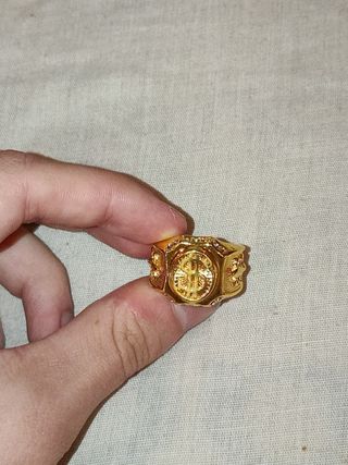 Anillo dorado de símbolo de dollar con brillantes 