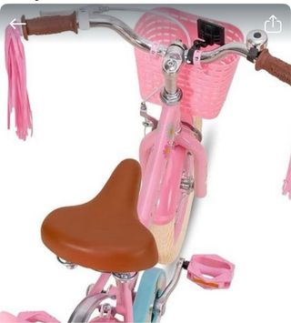 Bicicleta infantil rosa con cesta