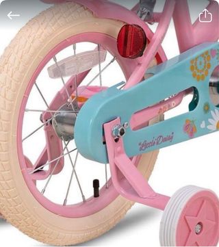 Bicicleta infantil rosa con cesta