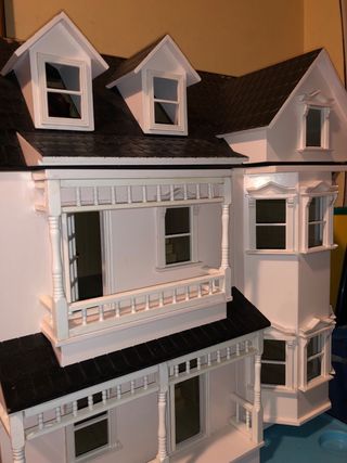 Casa de muñecas de madera