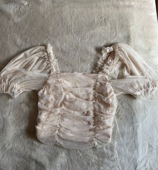 Top rosa empolvado con topos